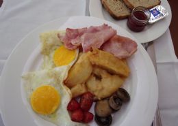 Breakfast-Fried or scrambled eggs with bacon, grill tomatoes and mushroom with homemade brown toast and homemade strawberry jam