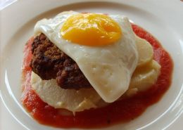 Beefy breakfast-Homemade beef patty with a fried egg on creamy potato bake and homemade tomato sauce.