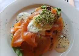 Trout sandwich with cream cheese and fresh orange on brown bread