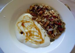 A gluten free and low carb granola with plain yoghurt and honey drizzle.